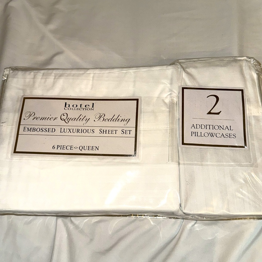 White Embossed Hotel Collection Sheet Set with four pillow cases. Queen Size.NWT